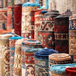 View of multiple carpets for sale at the Grand Bazaar in Istanbul, Turkey